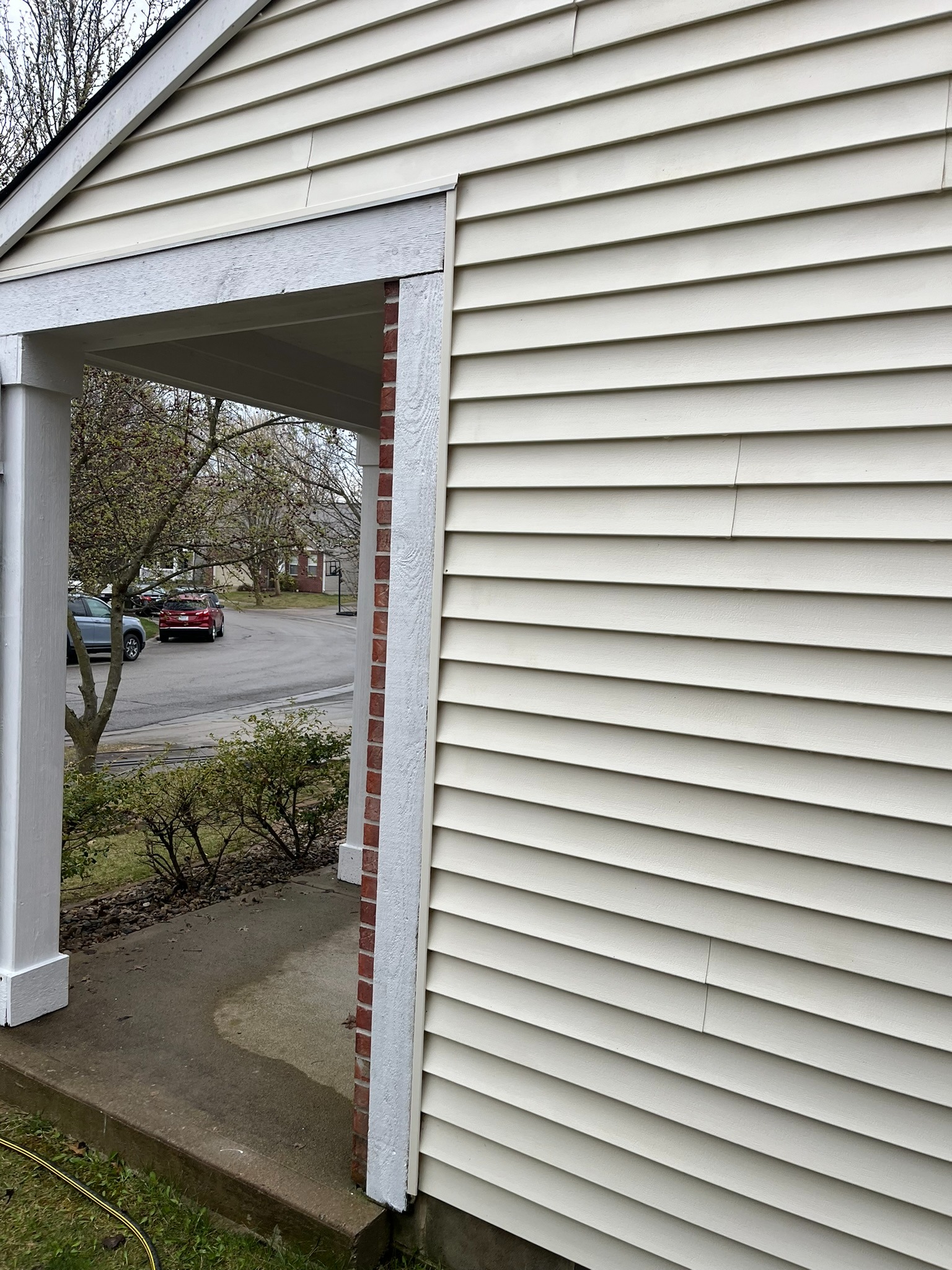 Clean house siding after professional soft wash